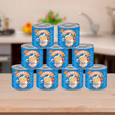Cowbell filled Evaporated Milk in a Tin.