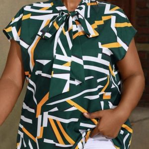 A flowery Free, Ladies Top, with  rope by the Neck. Size XXL